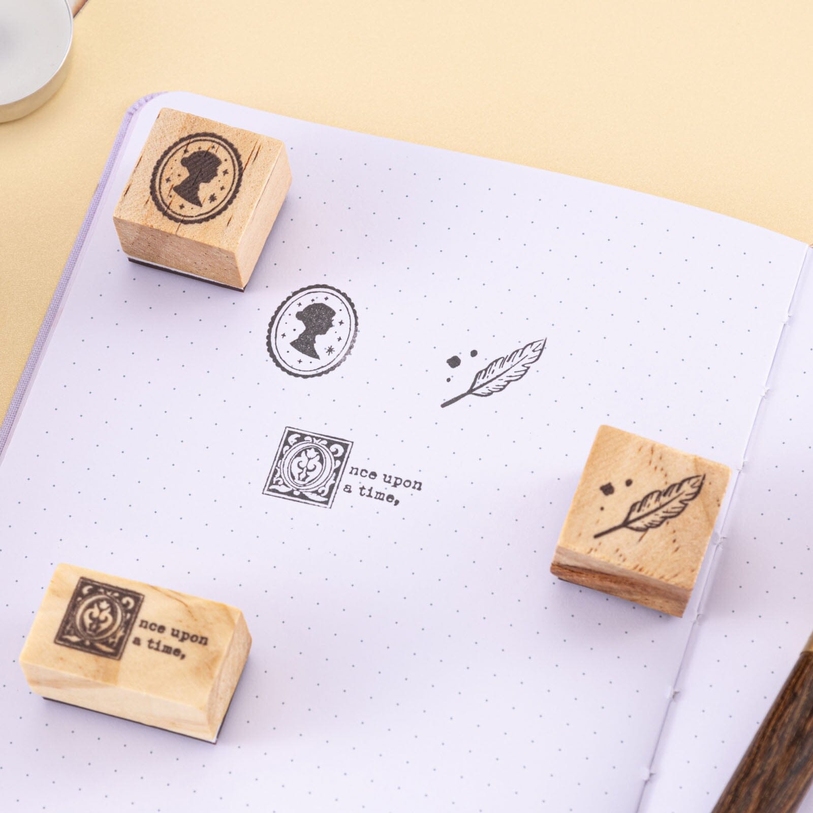 Tsuki Our Storries rubber stamp icons on white paper