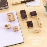 Chocolate brown rubber stamps with bookish design