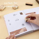 Hand stamping author head stamp with text ‘perfect for journaling’