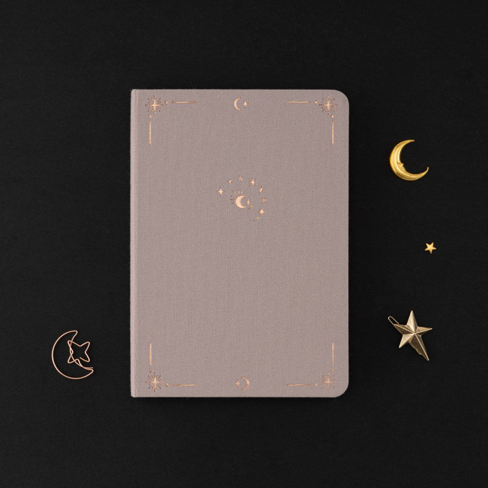 Tsuki Moonlit Dusk Bullet Journal with rose gold details and powdered lilac linen on black background