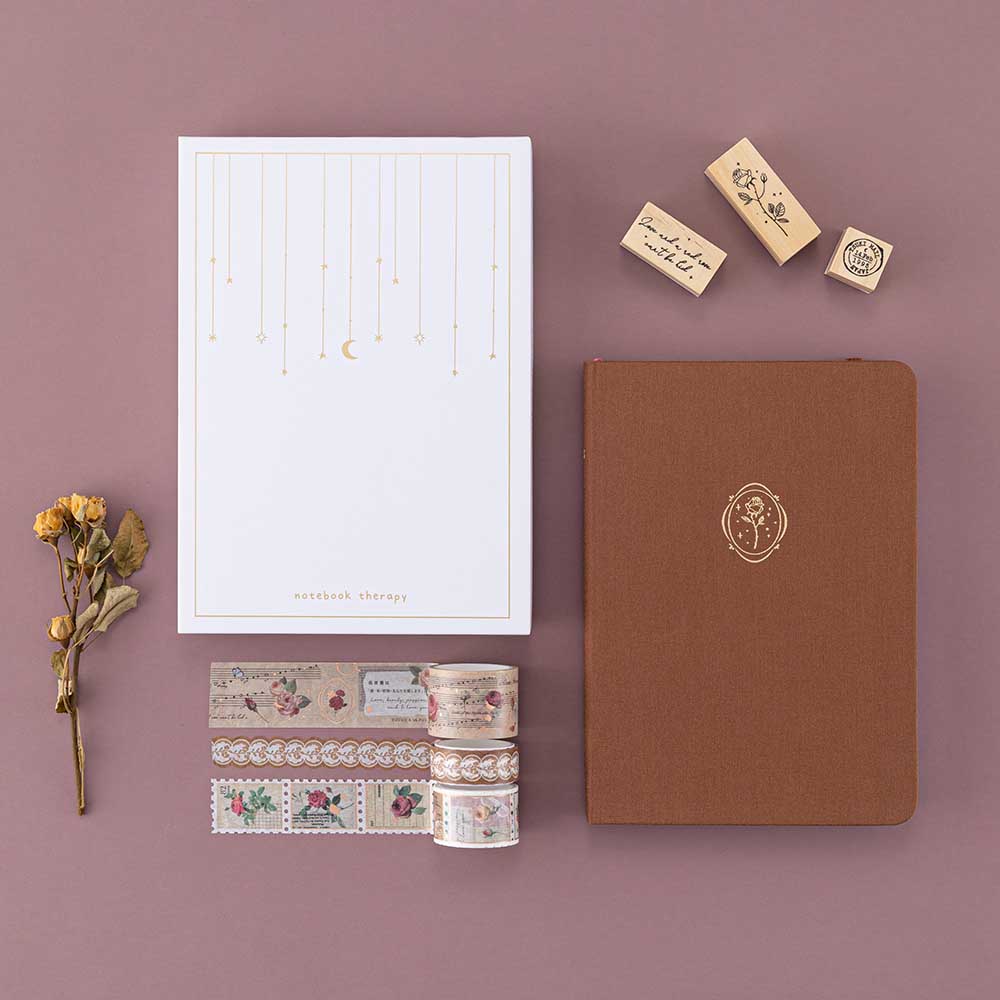 Tsuki ‘Vintage Rose’ Limited Edition Bullet Journal with luxury eco-friendly gift box with Tsuki ‘Vintage Rose’ Washi Tapes and Tsuki ‘Vintage Rose’ Bullet Journal Stamps with dried flowers on mauve background