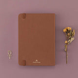 Back cover of Tsuki ‘Vintage Rose’ Limited Edition Bullet Journal with dried roses and free rose paperclip gift on mauve background