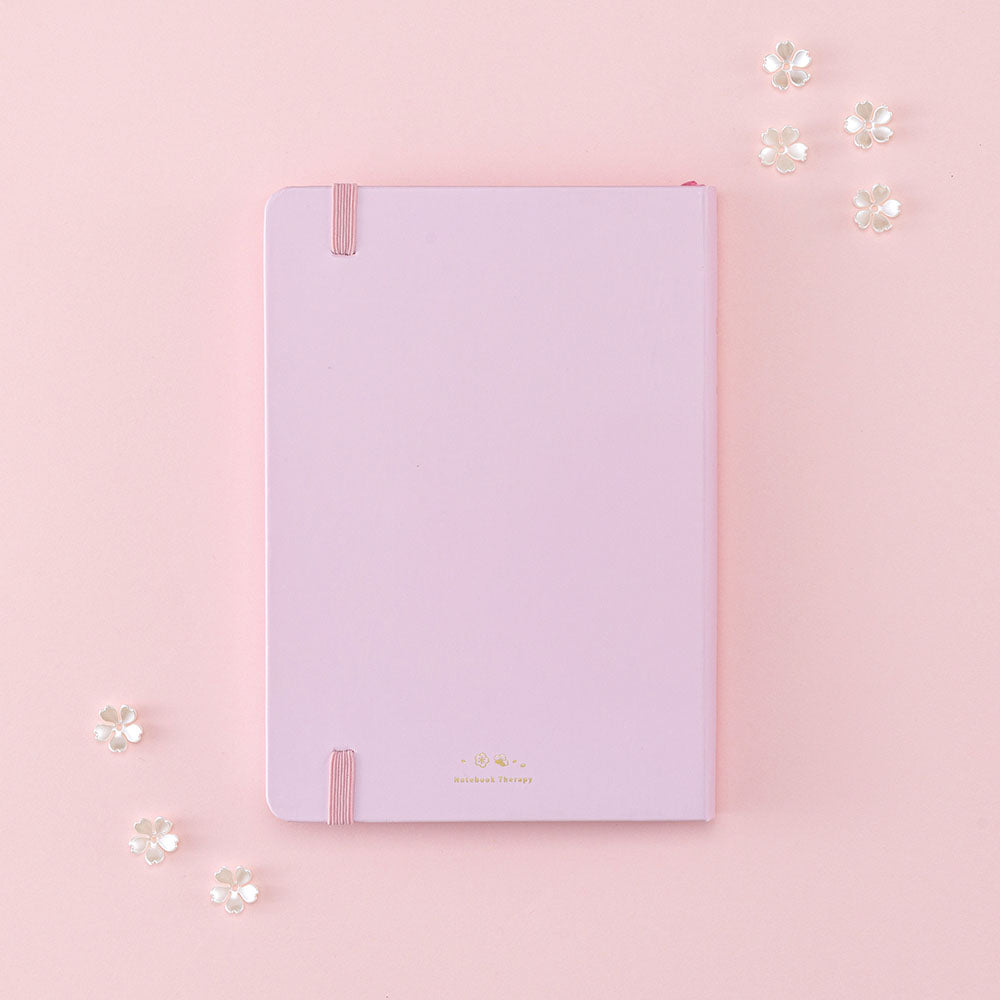 Back cover of Tsuki Four Seasons: Spring Collector’s Edition 2022 Bullet Journal with flowers on light pink background