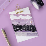 Tsuki ‘Falling Star’ Washi Tape Set rolled out on clipboard with pen and sparkl netting on purple background
