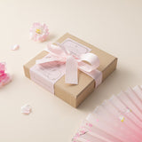 Hinoki into the blossom stamp set box with pink ribbon