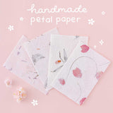 Close up of Tsuki ‘Sakura Journey’ Scrapbooking Set handmade petal paper bundle on pink background