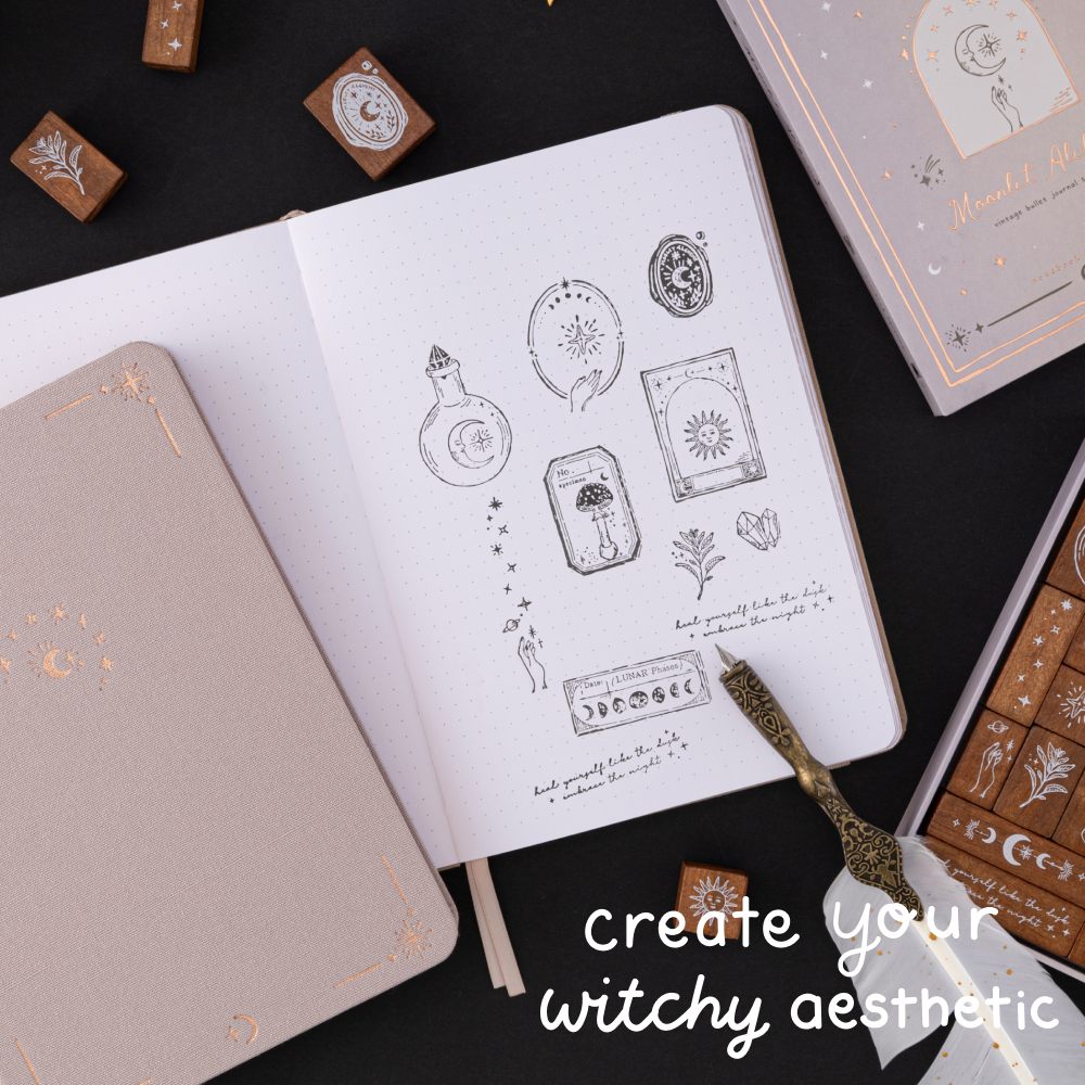 Tsuki ‘Moonlit Alchemy’ stamps on white page dotted bullet journal with text that reads “witchy aesthetic”
