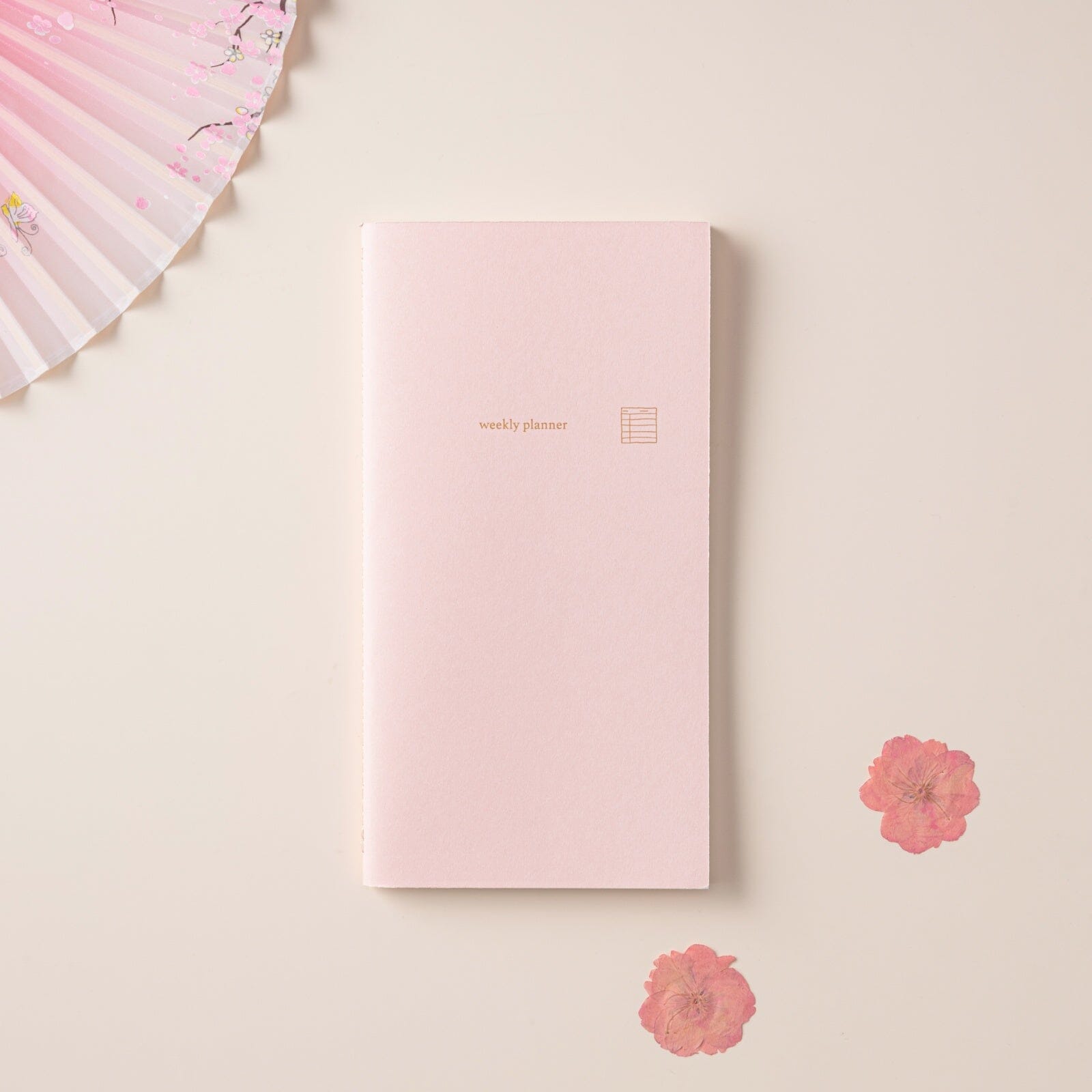 Weekly planner refill with pink cover for travel notebook