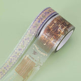 Tsuki ‘Enchanted Garden’ Matte Transparent Washi Tape rolls on green background