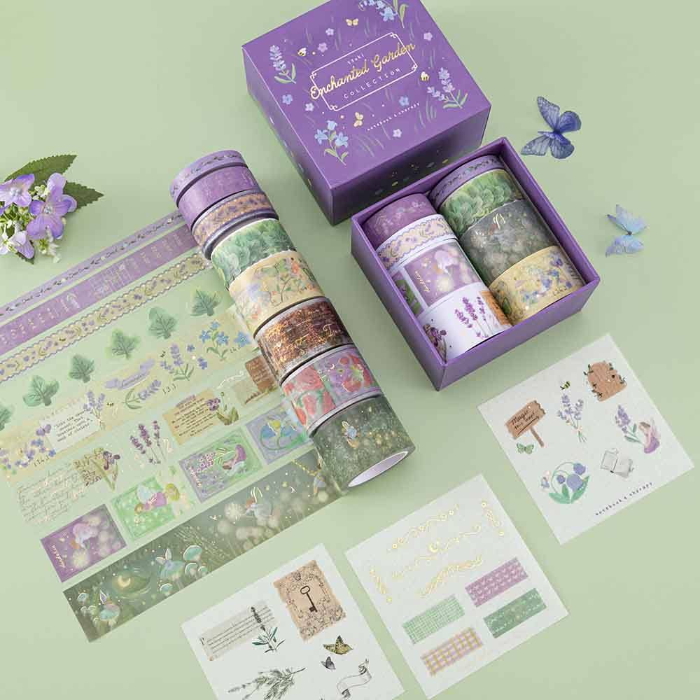 Tsuki ‘Enchanted Garden’ Washi Tape Set open box on sage green background with purple flower decoration