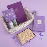 Tsuki ‘Enchanted Garden’ lavender foil design on purple linen bullet journal in wicker basket on purple background 