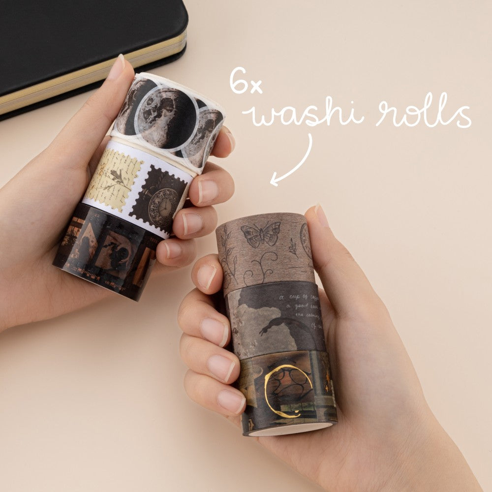Hands holding 6x washi tape rolls
