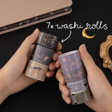 Hands holding Tsuki ‘Moonlit Alchemy’ washi tape rolls and a text that says “7x washi rolls”