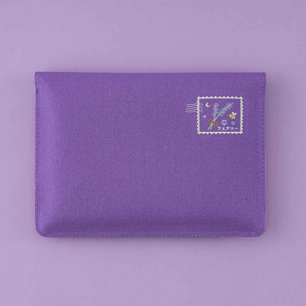 Back of notebook pouch on purple background