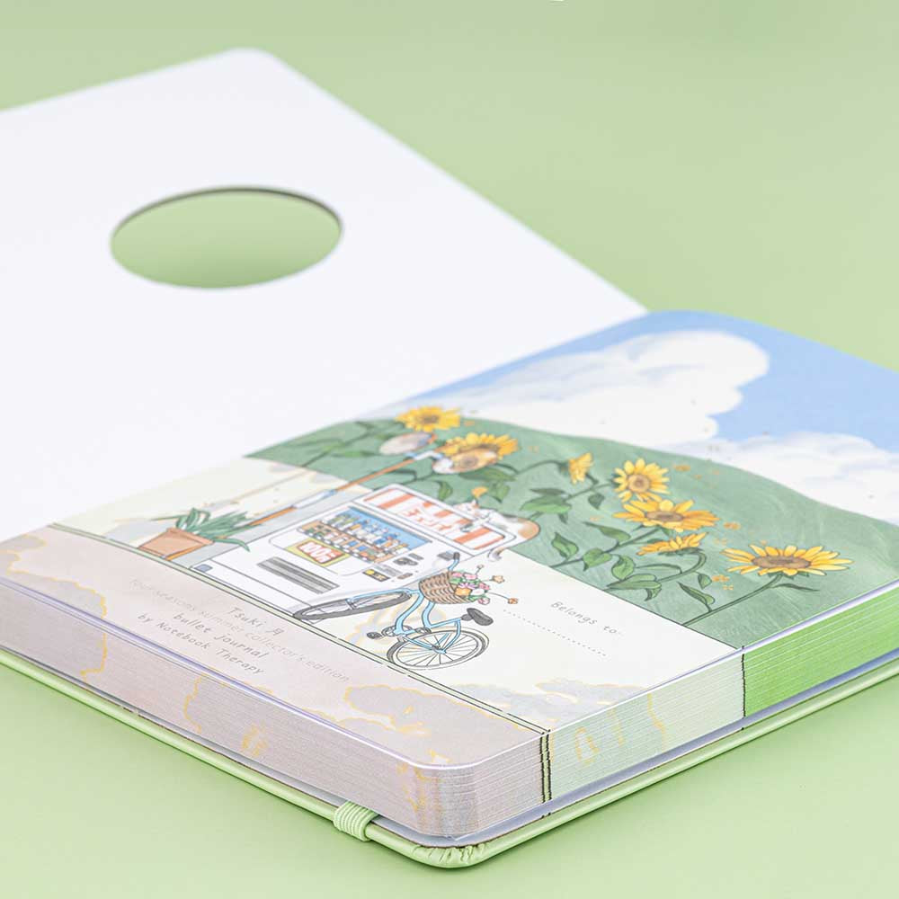 Angled photo of Tsuki Four Seasons Summer Collectors Edition 2022 sage bullet journal notebook