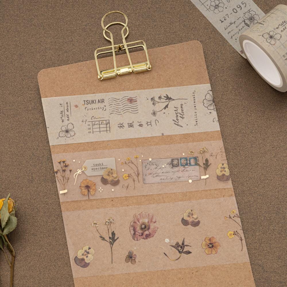 Washi rolls on brown card with gold clip