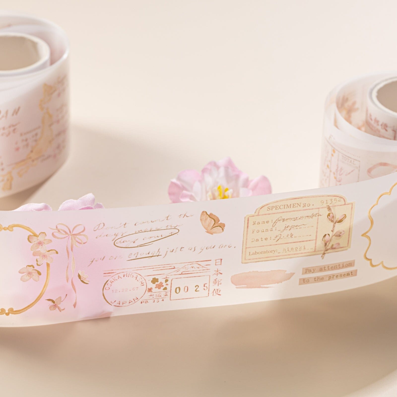 Close up of Hinoki into the blossom PET tape with letter stamp and lettering design