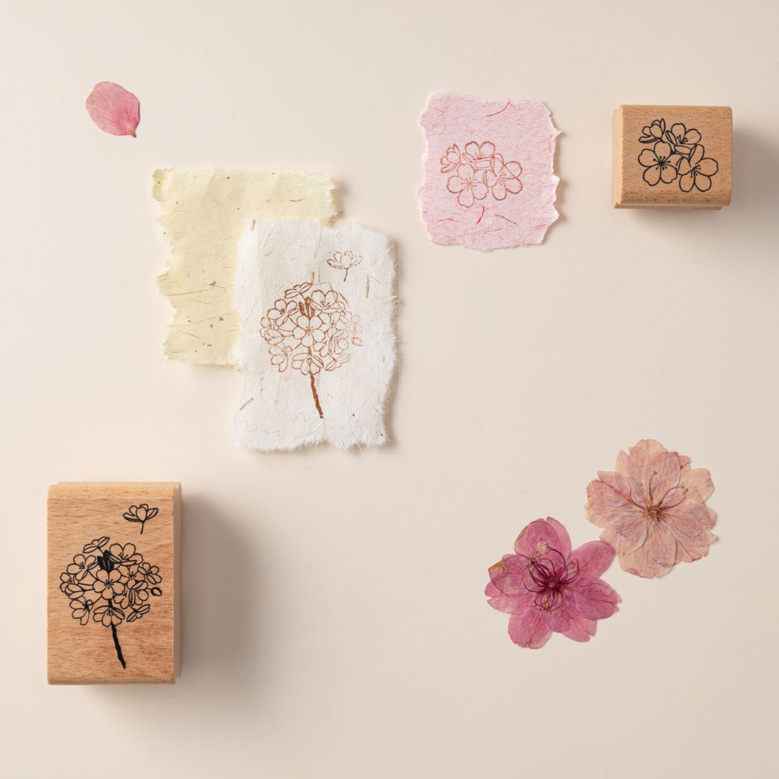 Hinoki into the blossom stamps on textured paper with dried flowers