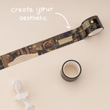 Collage washi tape with Dark Academia aesthetic on beige background. White lettering redas “create your aesthetic”