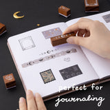 Hand stamping Tsuki ‘Moonlit Alchemy’ stamps on bullet journal with text that says “perfect fo journaling”