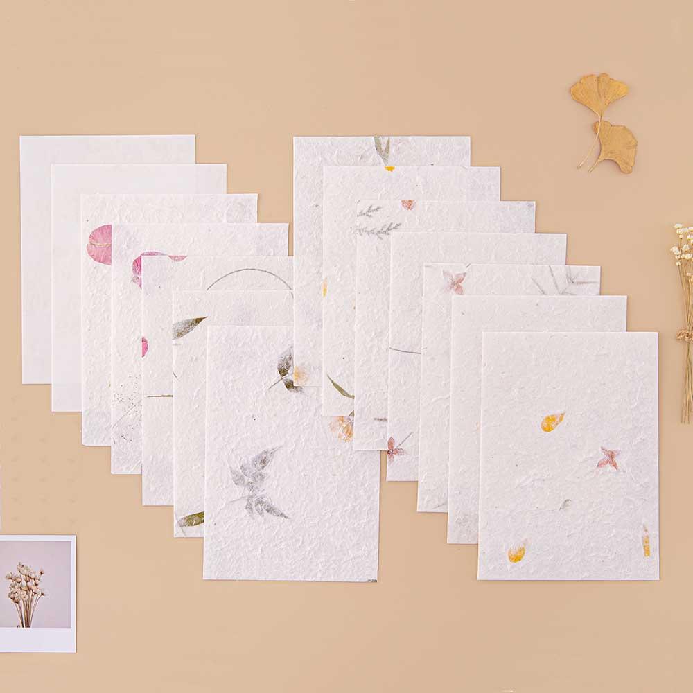 Tsuki Handmade Petal Paper Pack with polaroid picture and autumn leaves on beige background