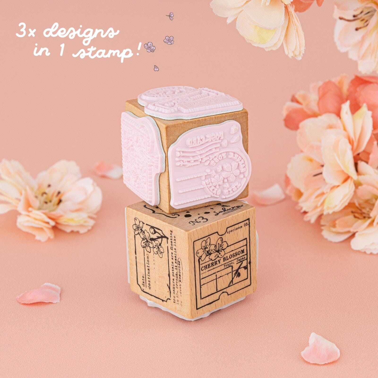 2x dice stamp with cherry blossom designs and text “3x designs in 1 stamp”