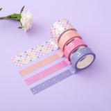 Tsuki Floral washi tapes rolled out on lilac surface
