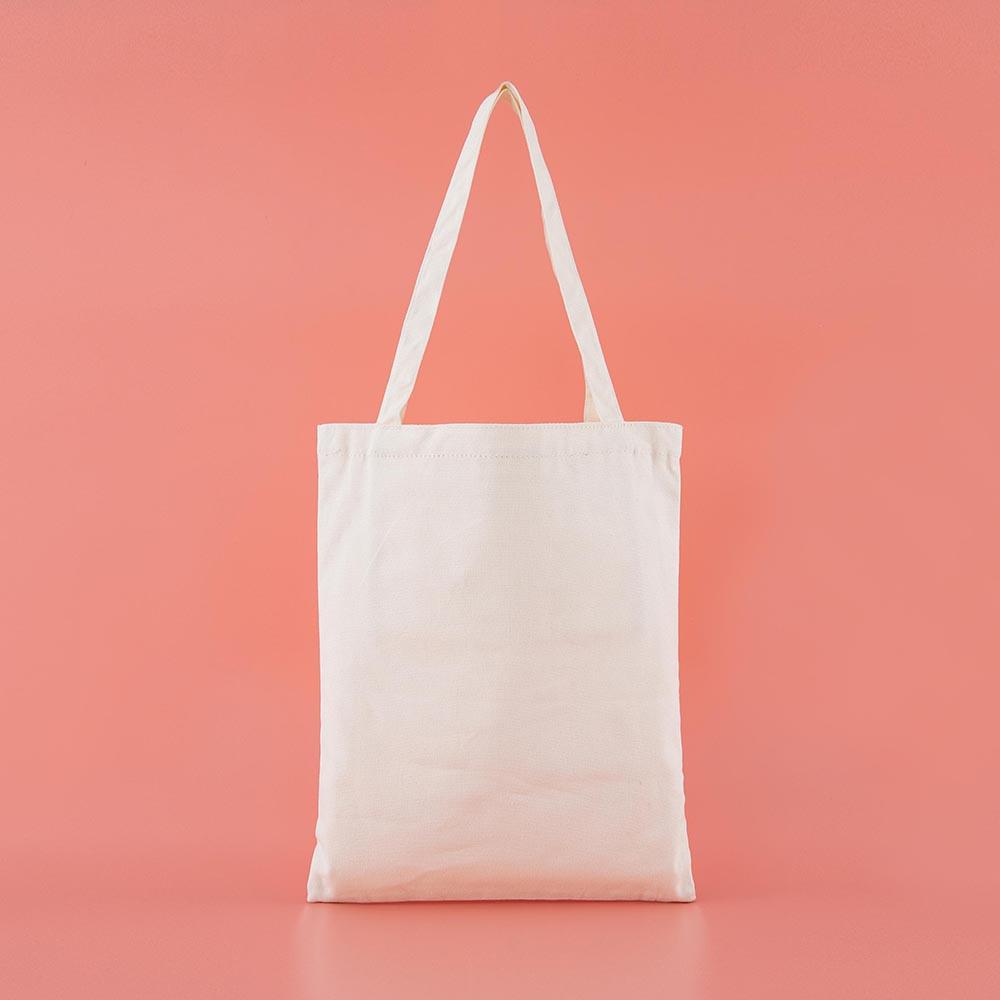 Back of Tsuki ‘Moonflower’ Limited Edition Tote Bag in coral pink background