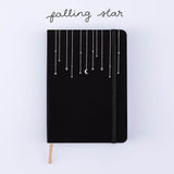 Tsuki Black Paper Limited Edition Hardcover Bullet Journal in Falling Star on white background