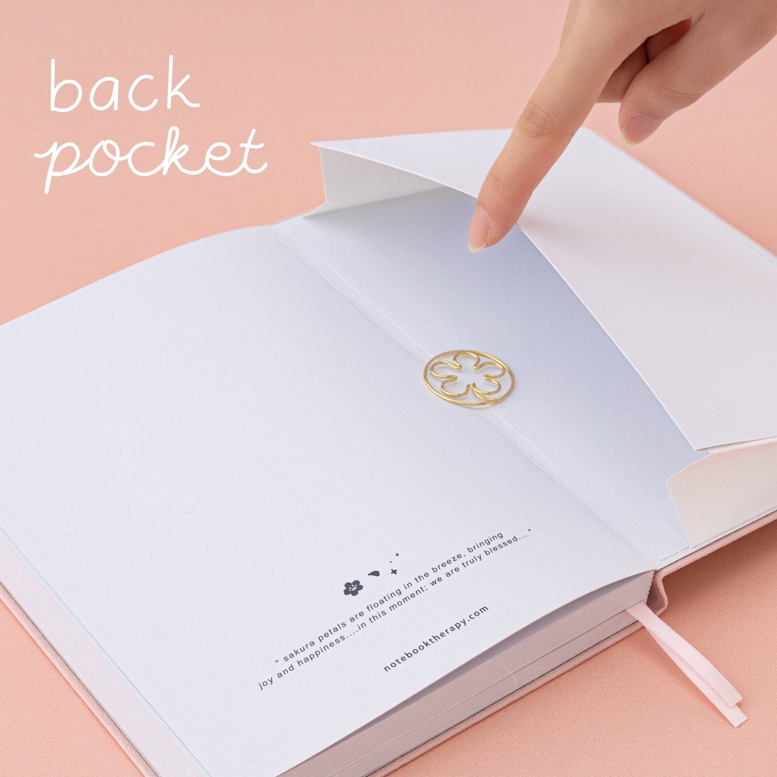 Back pocket of Tsuki Sakura Breeze limited edition bullet journal by Notebook Therapy with sakura paperclip inside