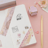 Stamps and washi tapes on travel notebook