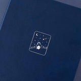 Close up of the front cover of Tsuki ‘Winter Wishes’ Limited Edition Bullet Journal on navy background