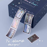 Close up of Tsuki ‘Dreams of Snow’ Holographic Stamp Washi Tape on light blue background