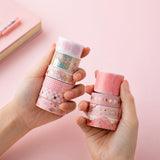 Tsuki 'Sakura Edition' Washi Tape Set held in hands over light pink background