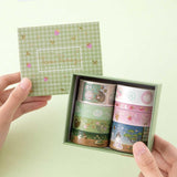 Tsuki ‘Matcha Ichigo’ Washi Tape Set held in hands in matcha green background