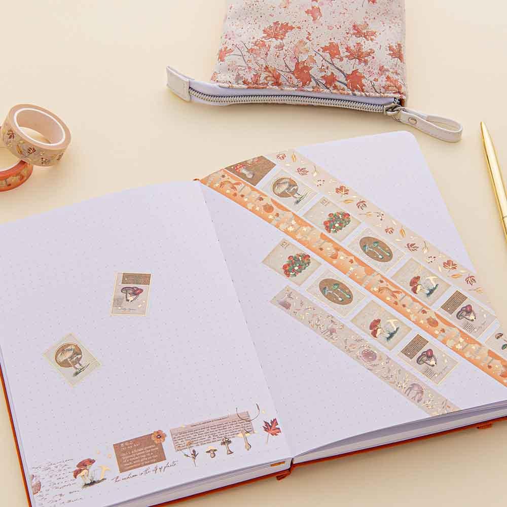 Tsuki ‘Maple Dreams’ Washi Tapes on open bullet journal page with Tsuki ‘Maple Dreams’ Pop-Up Pencil case in maple with gold pen on cream background