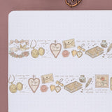 Close-up of PET love lock washi tape with romantic dove, locket and heart elements