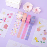 Tsuki Floral washi tapes rolled out with sticker sheets laid on lilac surface