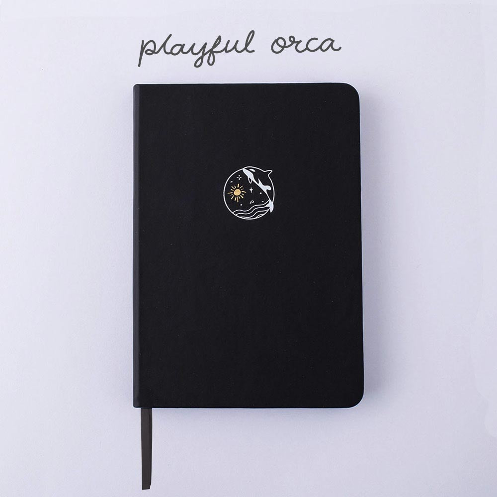 Tsuki Black Paper Limited Edition Hardcover Bullet Journal in Playful Orca on white background