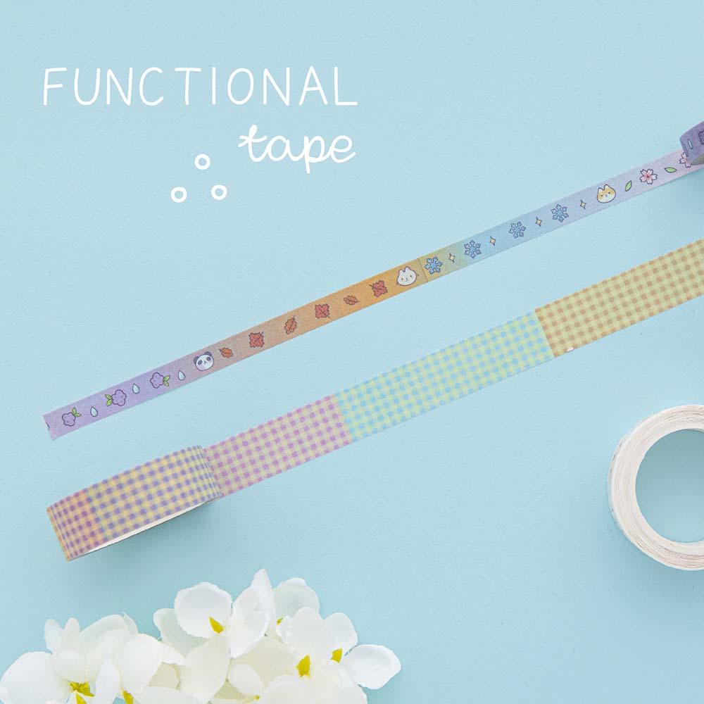 Tsuki ‘Four Seasons’ Functional Washi Tape by Notebook Therapy x Milkkoyo rolled out with white flower on light blue background