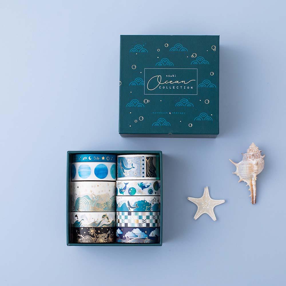 Tsuki Ocean Edition Washi Tapes and sticker sheet set with reusable eco-friendly gift box and starfish and seashell on blue background