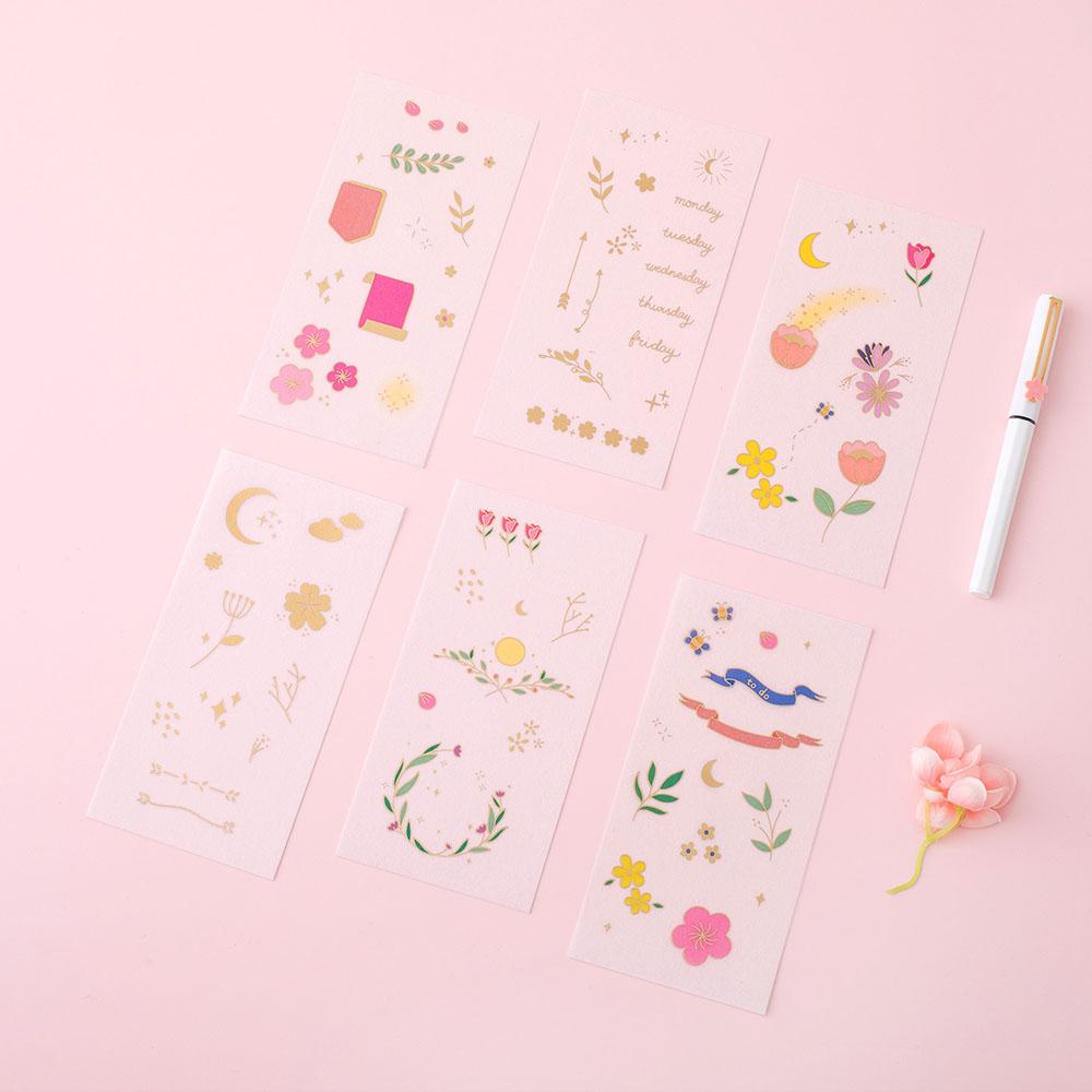 Tsuki Floral collection 6 sticker sheets laid out on pink surface