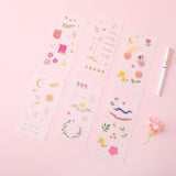 Tsuki Floral collection 6 sticker sheets laid out on pink surface