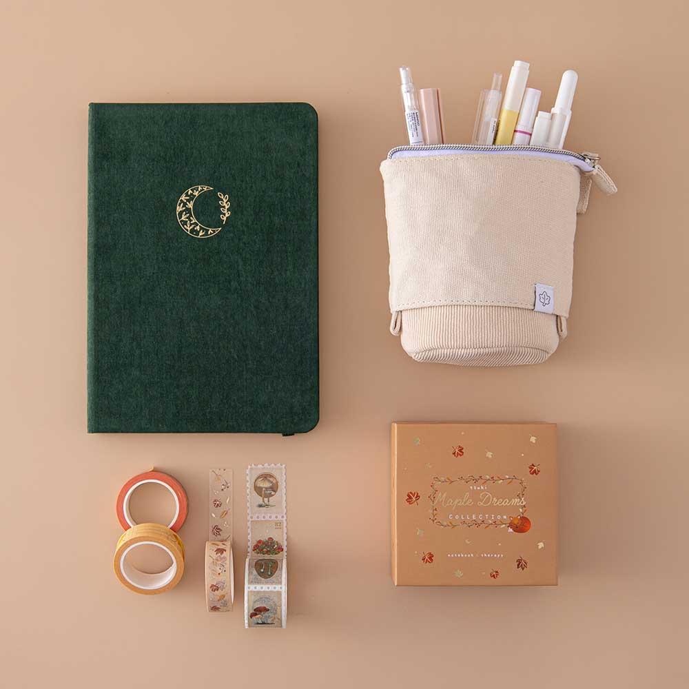 Tsuki ‘Midnight Garden’ Limited Edition Bullet Journal with Tsuki ‘Maple Dreams’ Washi Tape Set and Tsuki ‘Maple Dreams’ Pop-Up Pencil Case in stone on beige background
