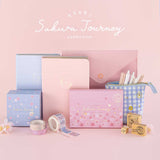 Tsuki Sakura Journey Collection with cherry blossoms in pink background