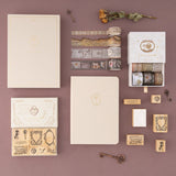 Flatlay of Tsuki Love Lock collection by notebook therapy including notebook, wasshi tape and stamps