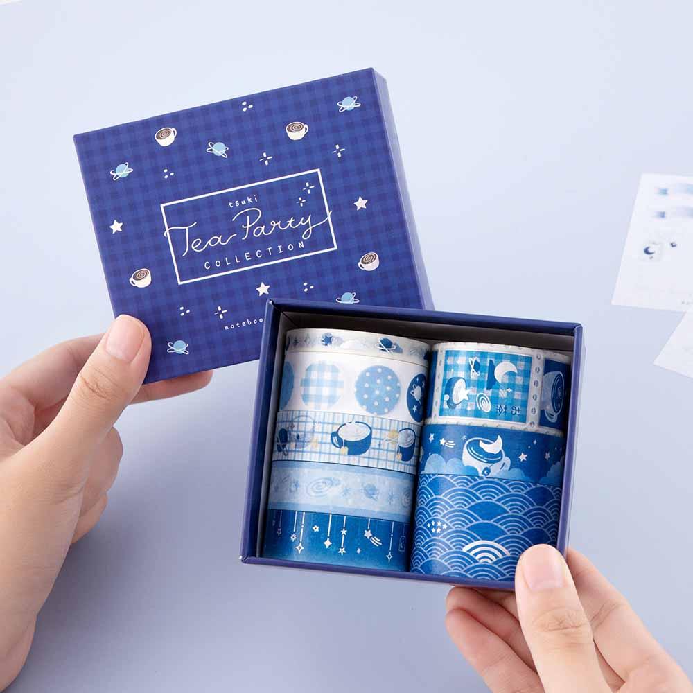 Tsuki ‘Cup of Galaxy’ Washi Tape Set held in hands in light blue background