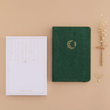 Tsuki ‘Midnight Garden’ Limited Edition Bullet Journal with eco-friendly gift box and free paperclip gift with dried flowers on beige background
