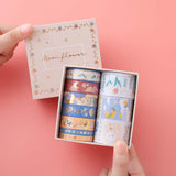 Tsuki ‘Moonflower’ Washi Tape Set with luxury eco-friendly box packaging held in hands in coral pink background