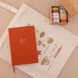 Tsuki ‘Kitsune’ Limited Edition Fox Bullet Journal with Tsuki ‘Maple Dreams’ Washi Tape Set on Tsuki ‘Vintage Kinoko’ Tote Bag on beige background